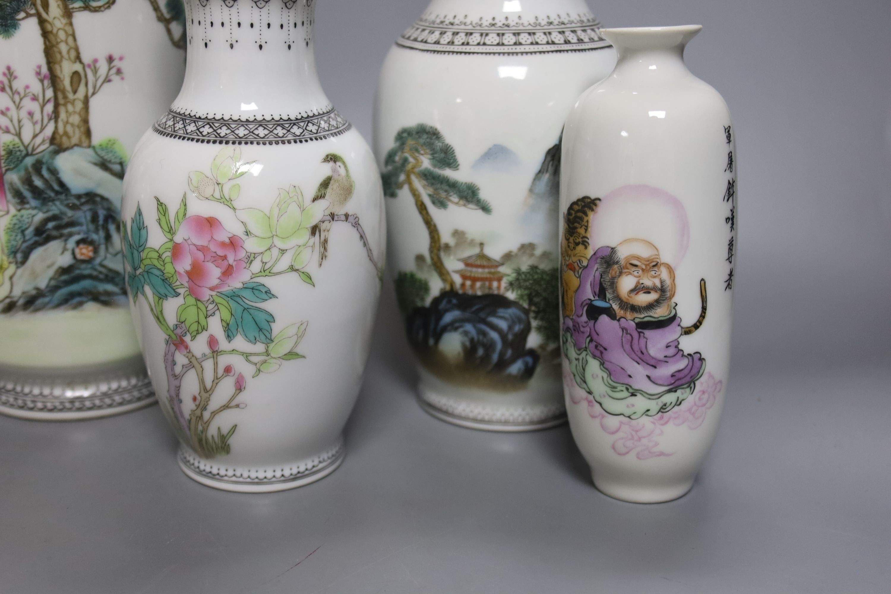 A group of seven Chinese famille rose vases, 20th century